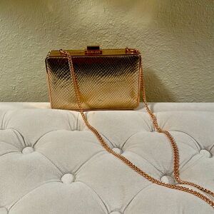 Michael Kors clutch rose gold